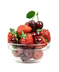 strawberries and cherries in a transparent piala isolated