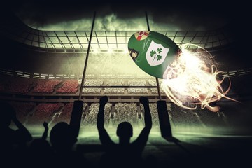 Composite image of silhouettes of football supporters