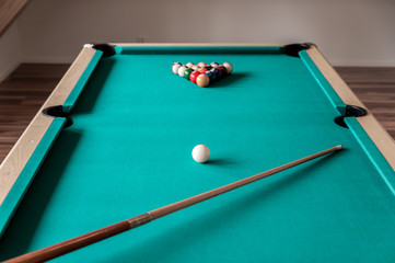 cue and balls on the table for billiard