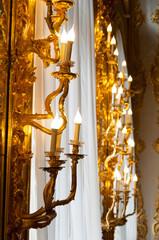 Fototapeta na wymiar vintage candlestick lamp glowing gold plated