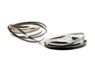 old film on two reels on a white background