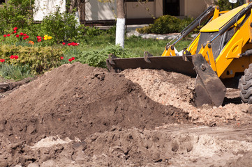 Obraz premium excavator works with the earth closeup