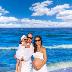 Fototapeta premium Family on the beach pregnant mother