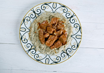 meat on a bed of baked eggplant