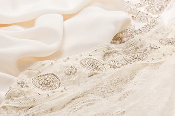 Obraz na płótnie Canvas Closeup ivory cloth for wedding dress