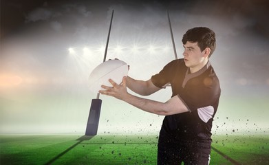 Composite image of rugby player receiving a side pass