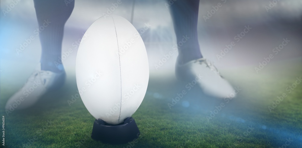 Poster composite image of rugby player ready to make a drop kick