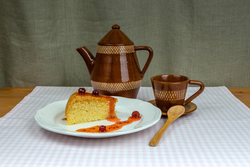 Homemade biscuit gooseberry jam, coffee pot and cup