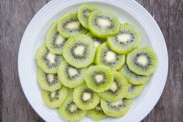 Slice Kiwi fruit on white plate