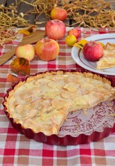 Apple pie, apples, and autumn leaves.