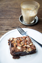 Cake chocolate brownies on wooden table in the coffee shop