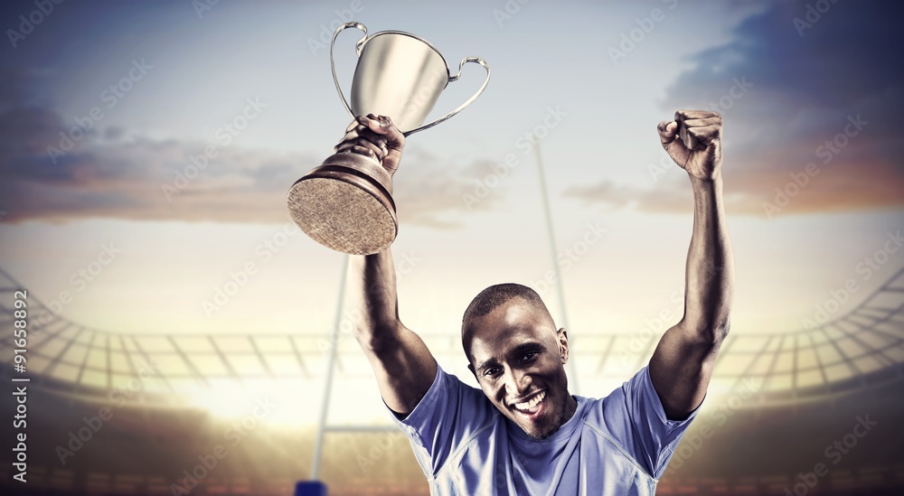 Wall mural composite image of portrait of happy sportsman cheering