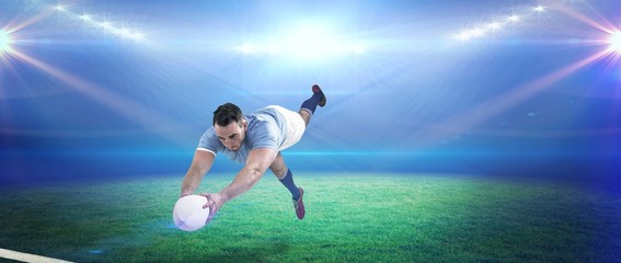 Composite image of rugby player scoring a try