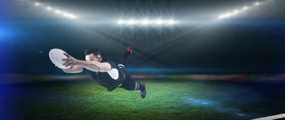 Obraz na płótnie Canvas Composite image of rugby player scoring a try