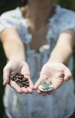 Hand hold small cup of coffee