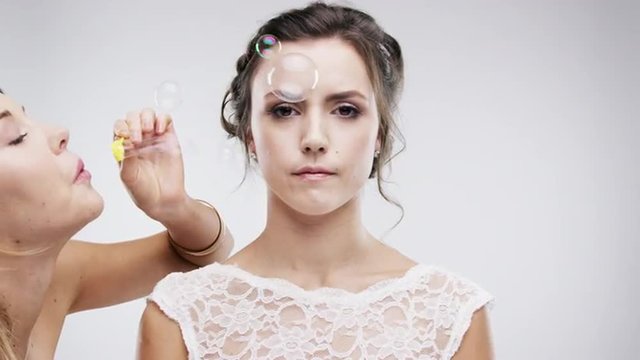 bridesmaid blowing bubbles slow motion wedding photo booth series