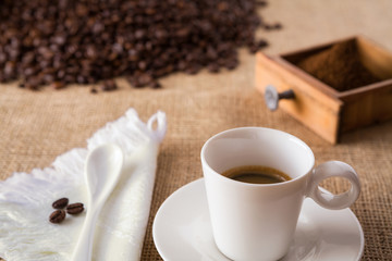 Coffee with coffee-beans on jute
