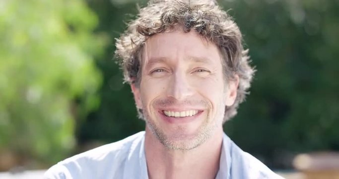 Attractive Mature man smiling portrait slow motion