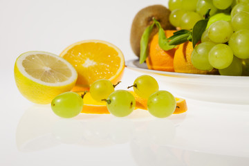 Sliced fruits and plate