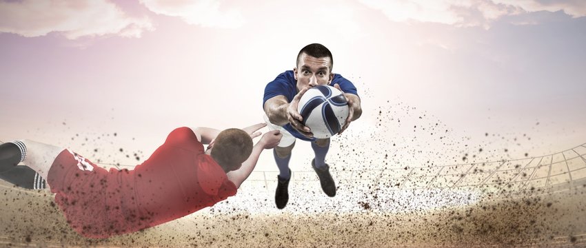 Composite image of a rugby player scoring a try - Powered by Adobe