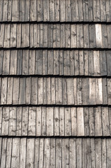 Old weathered fir wood shingle roof texture