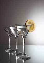 Glasses of martini and slice of lemon..