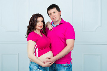 Fototapeta premium Young beautiful pregnant couple waiting for baby