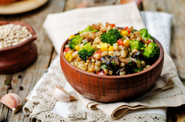 barley porridge with corn, broccoli, garlic, mushrooms and peppe