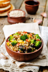 barley porridge with corn, broccoli, garlic, mushrooms and peppe