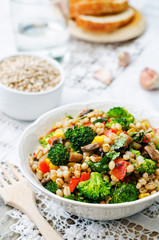 barley porridge with corn, broccoli, garlic, mushrooms and peppe