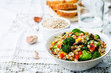 barley porridge with corn, broccoli, garlic, mushrooms and peppe