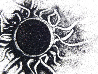 The sun of black glitter sparkle on white background