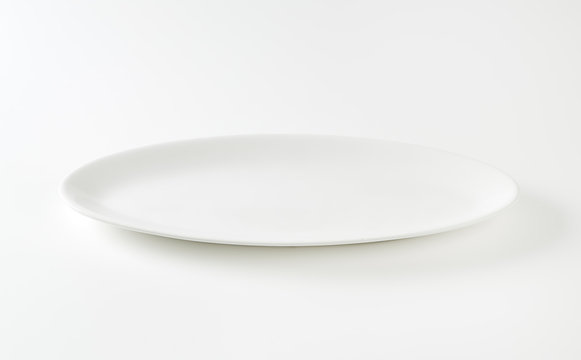 Empty oval white plate