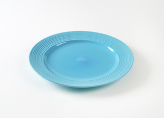 Turquoise dinner plate with wide rim