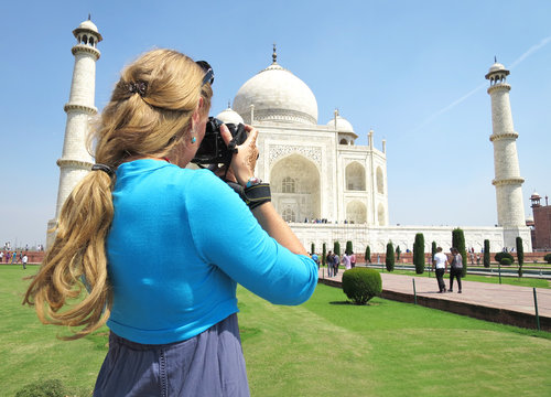 Girl taking a shot of Taj Mahal. Agra, India