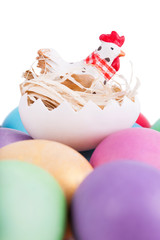 Chicken toy on easter eggs