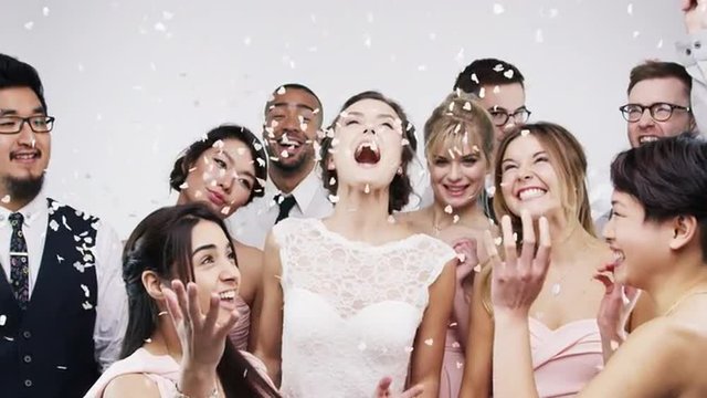 Multi racial group of friends dancing slow motion wedding photo booth series