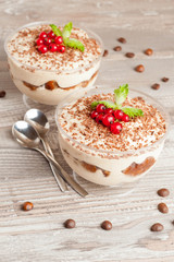 Tiramisu with red currant and chocolate in a glass