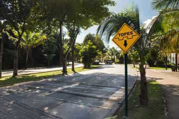 Topes speed bump sign at caribbean street, Mexico