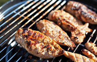 Grilled chicken breast on barbeque