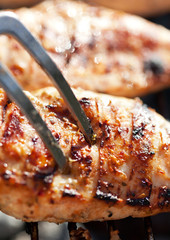 Grilled chicken breast on barbeque
