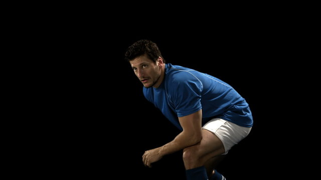 Serious rugby player playing in slow motion