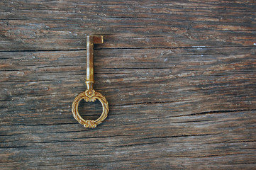 old vintage key on rustic wooden table