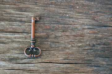 old vintage key on rustic wooden table
