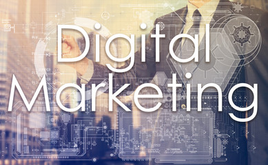 businessman writes on board text: Digital Marketing - with sunse