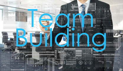 Obraz premium businessman writing on transparent board Team Building with offi