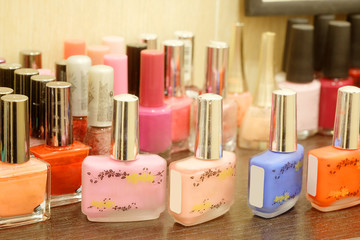 Close up of colorful nail polish bottles