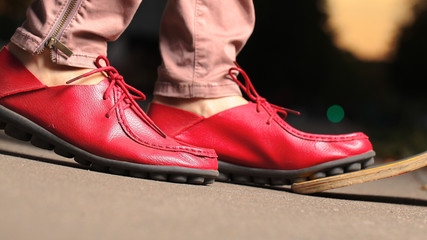 fancy red leather moccasins with laces Lofer on women's legs