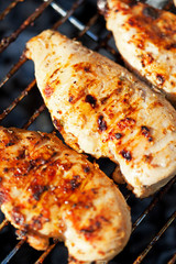 Grilled chicken breast on barbeque