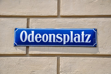 Odeonsplatz street sign on a house wall in Munich, Germany.